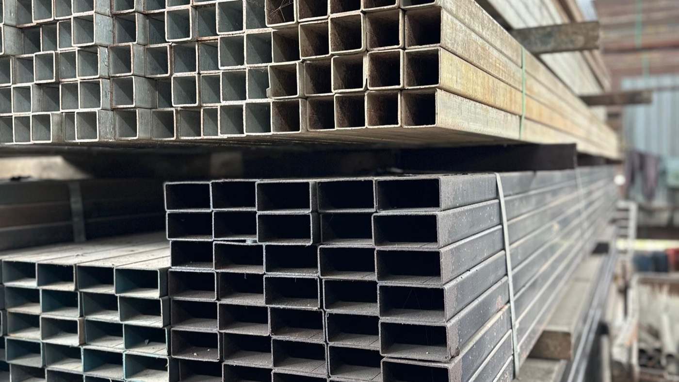 Bundles of square hollow steel sections stacked and banded at XXL Space Share