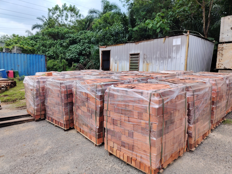 Pallets of clay bricks wrapped and stored in an XXL Space Share open-air shared storage yard